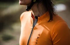 PEdALED Mirai Lightweight Women Jersey - Orange -KOO shop women cycling jersey front zip orange mirai pedaled